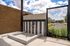 Modern outdoor dog wash area with stylish striped tiles and open-air design, perfect for refreshing moments under the sun.
