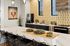 Modern kitchen with a stylish geometric backsplash, sleek countertops, and bar seating, highlighting a chic, contemporary design.