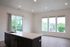 Modern open-concept living area with large windows offering stunning mountain views and abundant natural light.