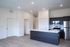 Modern kitchen with sleek cabinetry, stainless steel appliances, and a spacious island in a contemporary apartment.