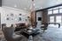 Chic living room with modern furniture, stylish wall art, and large windows for natural light.