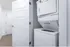 Modern apartment laundry room with sleek stacked washer and dryer set, offering convenience and efficiency.