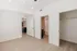 Modern apartment bedroom with sleek hardwood flooring, spacious walk-in closet, and en-suite bathroom.