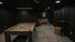 Luxurious game room featuring a stylish billiards table, elegant wood paneling, cozy seating area, and ambient lighting for a sophisticated recreational space.
