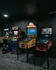 Chic arcade room featuring vintage pinball machines and racing games, perfect for entertainment enthusiasts.