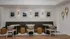 Chic and inviting dining area with modern seating, stylish wall art, and elegant lighting, perfect for social gatherings.