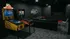 Trendy gaming lounge featuring retro pinball machines, sleek black furniture, and a modern entertainment setup.