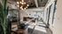 Modern lounge area with plush seating, stylish lighting, and large windows offering natural light, ideal for relaxation or meeting space.