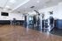 Bright and modern fitness center with state-of-the-art gym equipment and ample space for workouts.