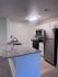 Modern kitchen with sleek granite countertops, stainless steel appliances, and elegant cabinetry