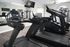 Modern fitness center with state-of-the-art treadmills and weight machines in a well-lit, mirrored space.