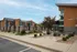 Modern apartment complex featuring sleek architectural design, manicured landscaping, and inviting outdoor areas.