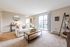 Living Room with sliding glass door opening onto a balcony | Princeton Reserve | Apartments Dracut MA