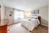 Light-filled bedroom in an apartment at Princeton Reserve in Dracut, MA.