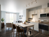 White cabinetry and stainless steel appliances in a prep-friendly kitchen at The Chandler | Your primary bedroom suite provides luxurious privacy with ensuite bathroom and walk-in closet convenience. | The Chandler | Bedford Apartments