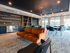 Gather with friends or meet your neighbors in the beautifully designed community room, offering a warm and comfortable atmosphere at our pet-friendly apartments in Bedford, NH. | The Chandler | Apartment in,Bedford NH