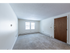 Carpeted living area in an apartment at Princeton at Mill Pond | Dover New Hampshire Apartments
