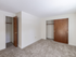Living area featuring two closets in an apartment at Princeton at Mill Pond | Dover NH Apartments For Rent