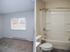 This Jack-n-Jill bathroom provides shared access between bedrooms with separate vanity areas for privacy. | Princeton Commons | Apartment in Claremont, NH