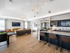 Brand new community room featuring plank-style flooring and large windows  at Princeton Westford apartments in Westford, MA.