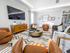 Brand new community room cozy seating and large flat-screen TV  at Princeton Westford apartments in Westford, MA.