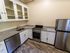 Your kitchen with black appliances provides contemporary elegance with reliable functionality for all cooking needs.  | Princeton on Beacon Street |