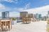 Relax, entertain, and enjoy breathtaking, sweeping skyline views from the building's stunning roof deck. | 381 Congress Lofts | Apartments For Rent in Boston