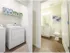 Laundry setup in a closet and door opening into bathroom | Apartments For Rent In Chelmsford MA | Mill and 3 Apartments