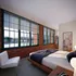 Your spacious primary bedroom offers comfortable proportions with space for all your furniture and personal items.  | Watch Factory Lofts |