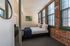 Your primary bedroom suite provides luxurious privacy with ensuite bathroom and walk-in closet convenience.  | Watch Factory Lofts | Waltham Apartments