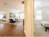 Spacious living room between two bedrooms at Mill & 3 Apartments  in Chelmford, MA.