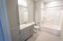 Your light-filled principal bathroom offers refreshing space with natural light and comfortable proportions. | The Chandler | Apartment in,Bedford NH