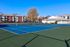 Enjoy a friendly match with neighbors on the beautifully surfaced tennis court at our scenic apartments in Worcester, MA. | Princeton Place | Princeton Place Apartments