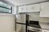 This contemporary kitchen features clean lines, functional layout, and quality finishes for efficient meal preparation. | Princeton on Beacon Street |