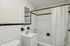Your light-filled principal bathroom offers refreshing space with natural light and comfortable proportions. | Princeton on Beacon Street | Apartment in Brookline, MA