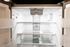 The James Apartments | Interior view of an open stainless steel refrigerator showing clean, empty shelves and door compartments | Luxury Apartments in Haverhill MA