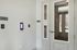 The James Apartments | Secure apartment building entryway with ButterflyMX access system and a digital screen displaying ‘Welcome.' The entry is adjacent to a package room sign | Apartments for Rent Haverhill MA