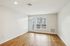 The James Apartments | Spacious unfurnished living room with large window, natural light, and a balcony door at 895 Boston Rd. | Luxury Apartments Haverhill MA