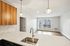 The James Apartments | Modern kitchen at 895 Boston Rd featuring wood cabinetry, stainless steel appliances, and a central island with a built-in sink. | Luxury Apartments Haverhill MA