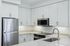 Modern kitchen with sleek stainless steel appliances, elegant white cabinetry, and stylish quartz countertops.