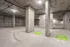 Spacious modern parking garage with designated EV charging spots, enhancing convenience and sustainability.