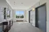 Grandview Apartments | A hallway at Grandview Apartments in Lowell, MA features two elevators and a window. | Apartments with Balcony in Lowell