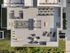 Aerial view of The Charley Apartments in Allston MA, showcasing a modern rooftop terrace with lounge chairs, seating areas, tables, a pergola, plants, and a fire pit on a large tiled deck surrounded by greenery. | The Charley | Apartment in Allston, MA