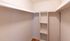 Spacious walk-in closet with built-in shelving and elegant wooden flooring, perfect for organized storage.Your spacious kitchen offers generous square footage with room for multiple people and all your cooking essentials.  | The Royal Crest | Apartment in,North Andover MA