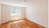 Cozy sunlit room with large window and elegant hardwood flooring, perfect for a tranquil living space.Your spacious kitchen offers generous square footage with room for multiple people and all your cooking essentials.  | The Royal Crest | Apartment in,North Andover MA