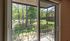 Bright and inviting view from a modern apartment balcony, overlooking lush green trees and a picturesque courtyard.Your spacious kitchen offers generous square footage with room for multiple people and all your cooking essentials.  | The Royal Crest | Apartment in,North Andover MA