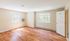 Bright, spacious room featuring elegant wood flooring, large windows with natural light, and a modern air conditioning unit.Your spacious kitchen offers generous square footage with room for multiple people and all your cooking essentials.  | The Royal Crest | Apartment in,North Andover MA