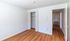 Bright empty room with elegant wood flooring and open closet, leading to a welcoming hallway with natural light.Your spacious kitchen offers generous square footage with room for multiple people and all your cooking essentials.  | The Royal Crest | Apartment in,North Andover MA
