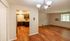 Bright and inviting open-plan living area with elegant hardwood floors, adjacent to a cozy kitchen with modern cabinetry and stainless steel appliances.Your spacious kitchen offers generous square footage with room for multiple people and all your cooking essentials.  | The Royal Crest | Apartment in,North Andover MA