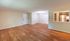Inviting open-concept living space with elegant hardwood floors, a cozy dining area, and a modern kitchen through a pass-through window.Your spacious kitchen offers generous square footage with room for multiple people and all your cooking essentials.  | The Royal Crest | Apartment in,North Andover MA